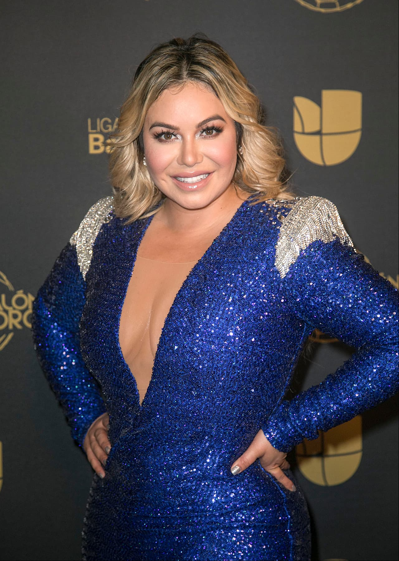 Chiquis Rivera roba miradas en boda con sexy vestido
