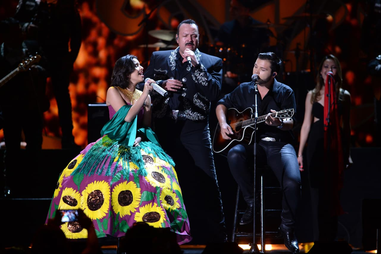 MIAMI, FL - NOVEMBER 04: Angela, Pepe and Leonardo Aguilar perform onstage during the iHeartRadio Fiesta Latina: Celebrating Our Heroes at American Airlines Arena on November 4, 2017 in Miami, Florida. (Photo by Jason Koerner/Getty Images for iHeart Radio)